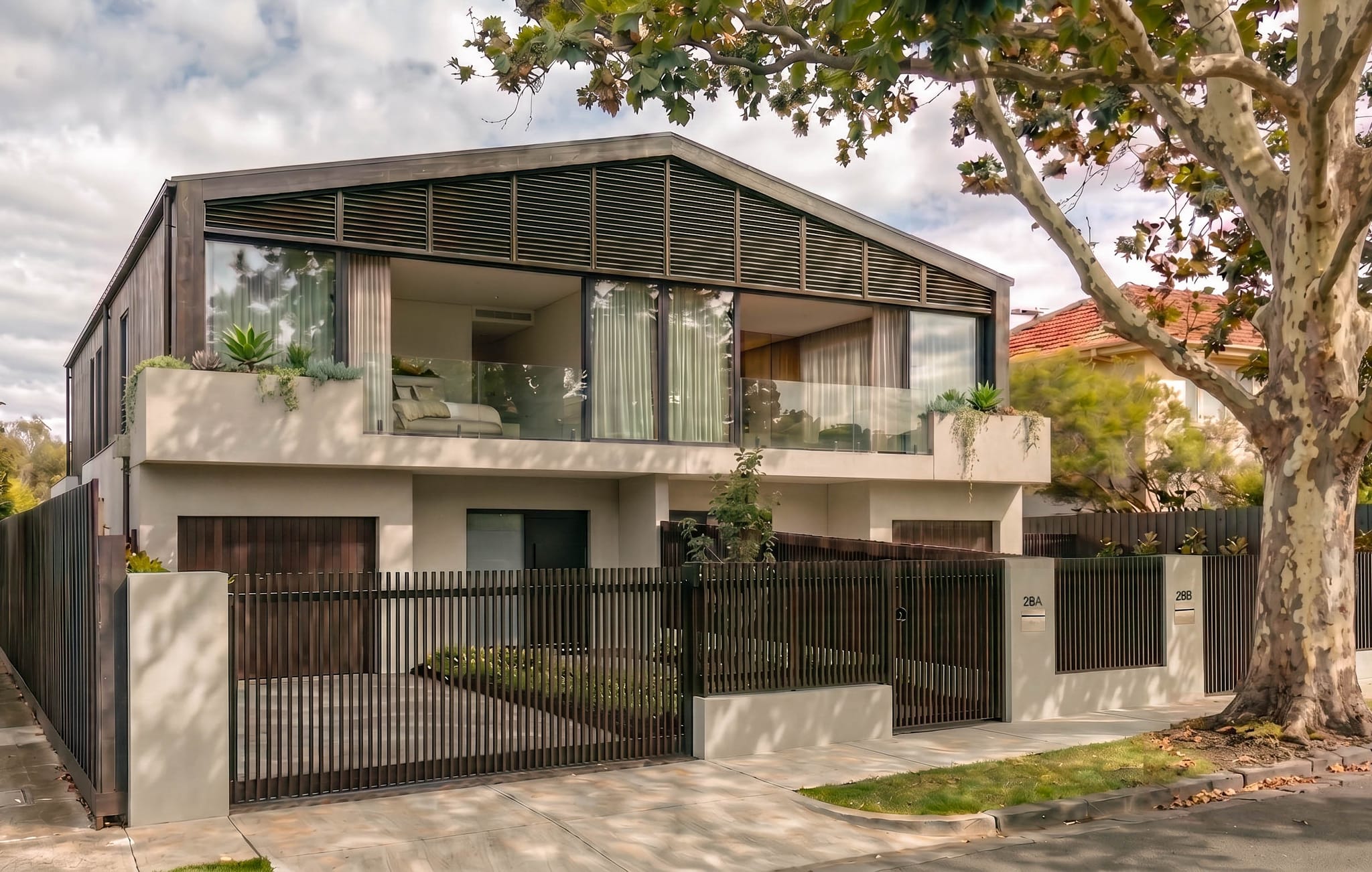 Luxury duplex exterior in north west Sydney: dark timber battens and a louvred gable screen, Project 28 by Aomura Studio