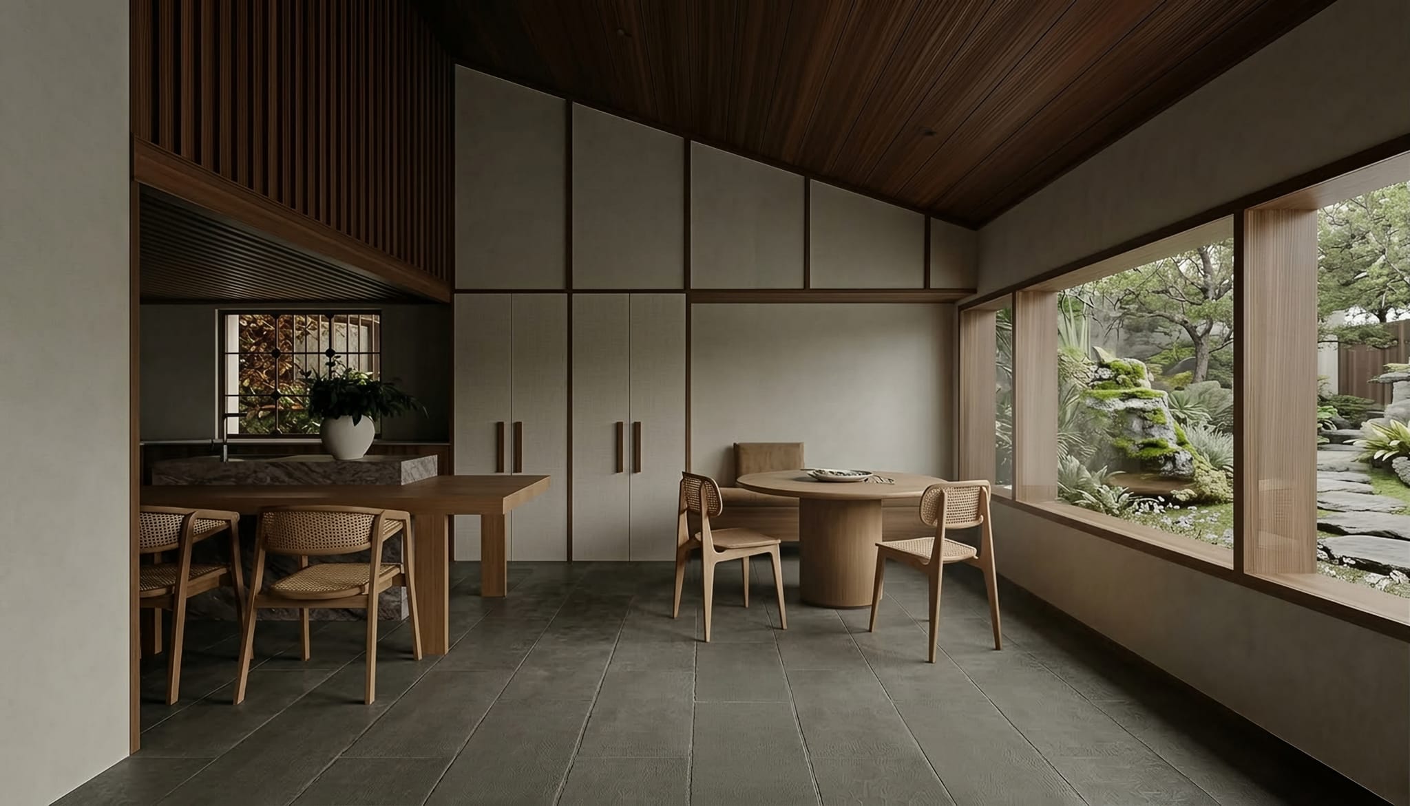 Dining nook in a Japanese-influenced timber interior, cane chairs and a round table beside a picture window framing a mossy garden courtyard.